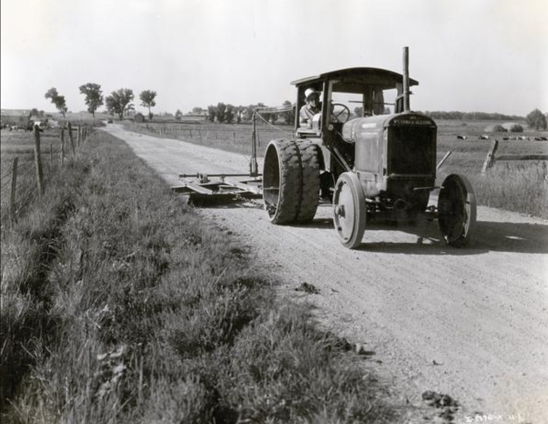 2024.04.28 - Mogul 30 tractor grading a gravel road.jpg
